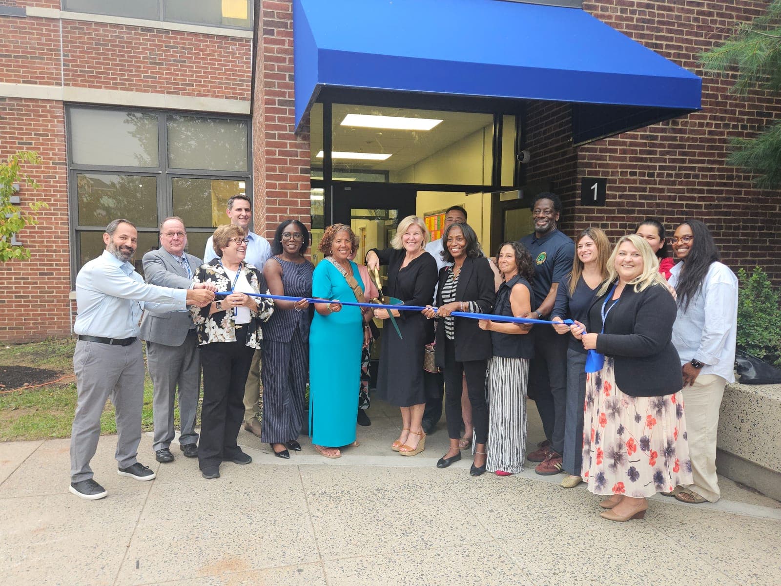 Officials and staff cut the ribbon to officially open La Grande Elementary School.
