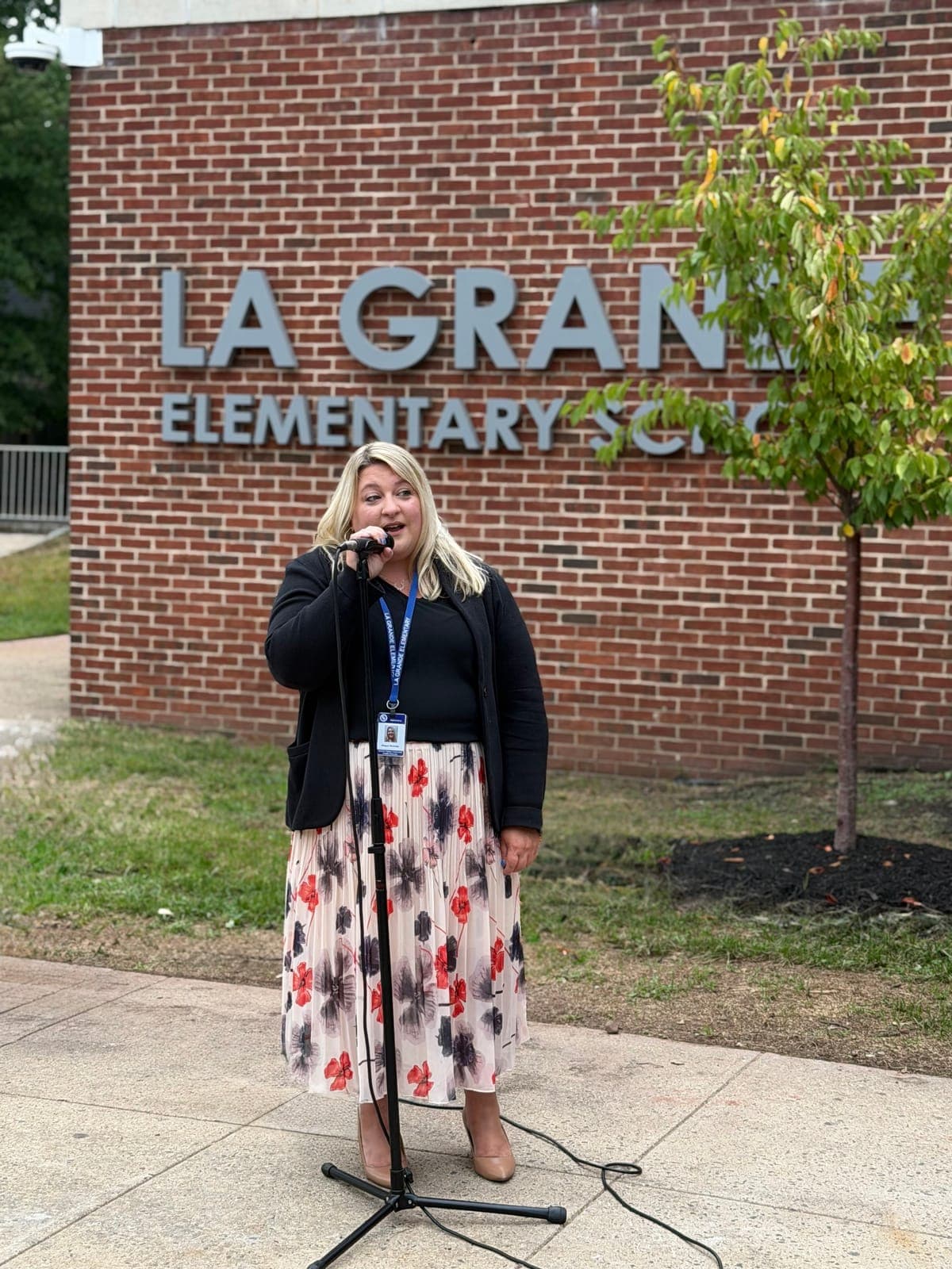 A district official addresses the crowd gathered outside La Grande Elementary School ahead of the Sept. 1 ribbon-cutting ceremony.