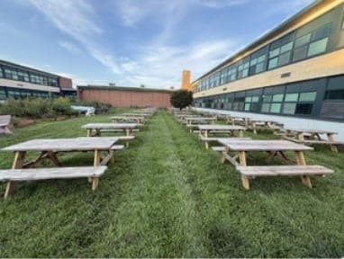 New picnic tables donated by alumni Joe Mortarulo and John "Skip" Brandli fill the Scotch Plains-Fanwood High School courtyard.