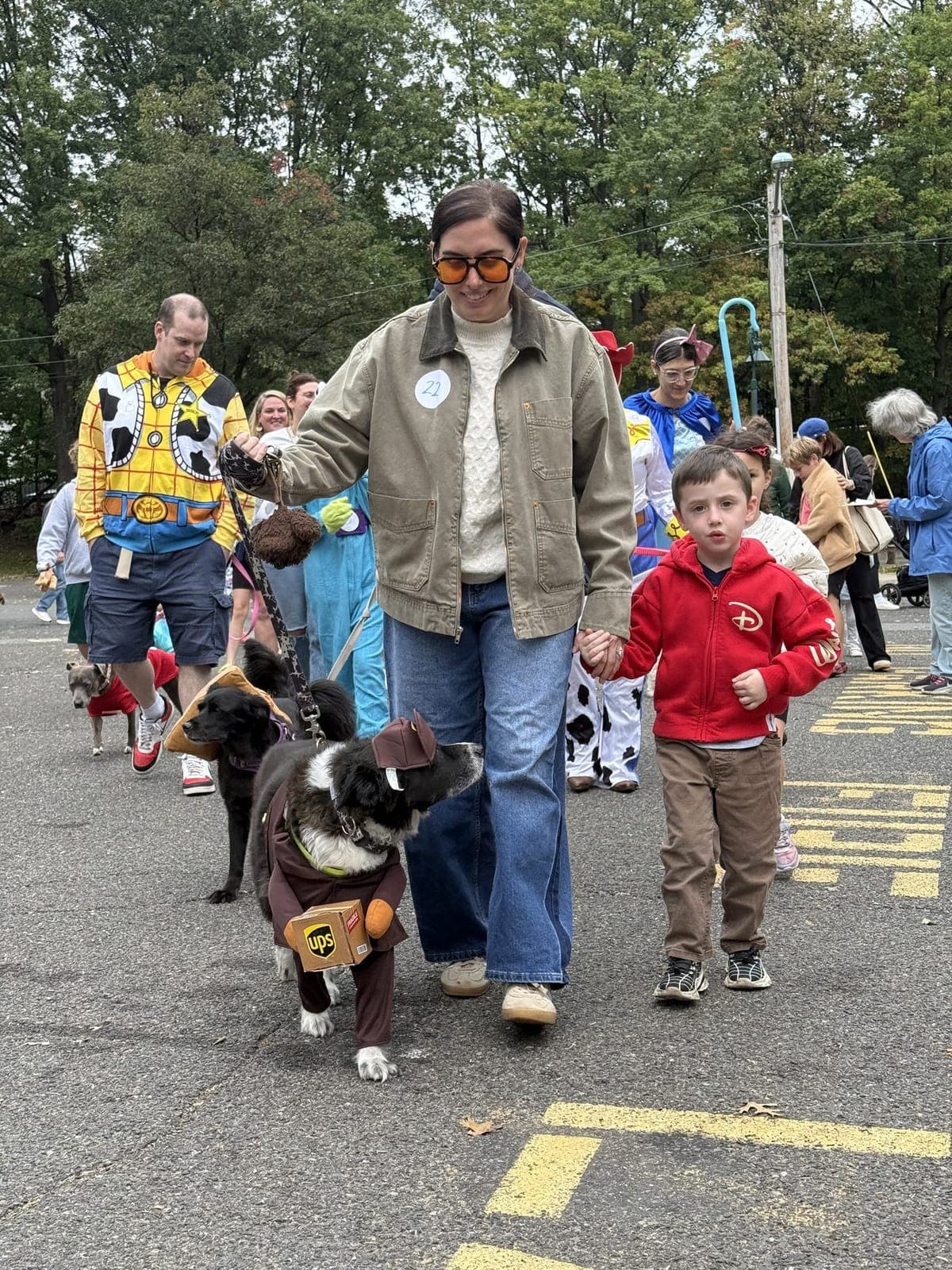 Costumed dogs and their families join the parade.