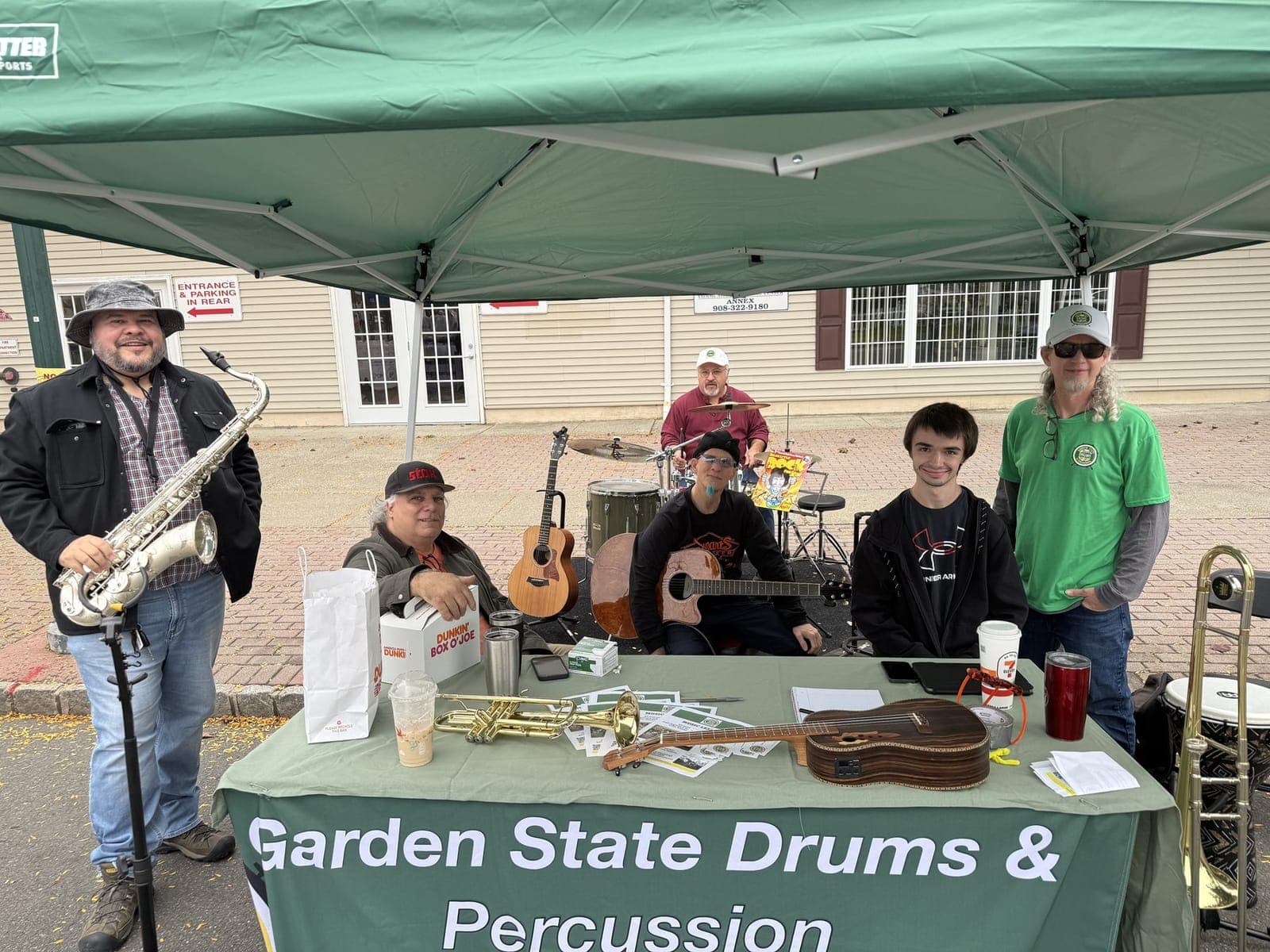 Local musicians perform under a tent along Park Avenue.